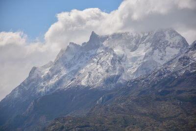 Scenic view of snow covered mountains against sky