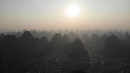 Scenic view of mountains against sky during sunset