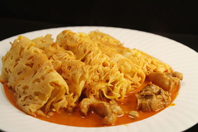 Close-up of pasta in plate on table