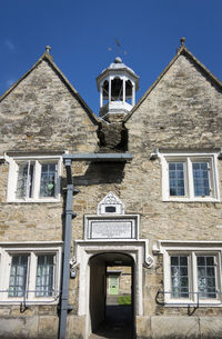 Low angle view of building against blue sky