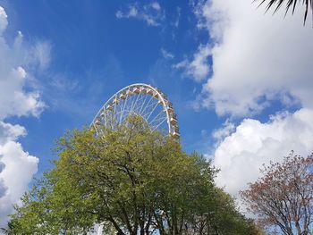 Low angle view of ferris wheel against sky