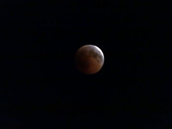 Low angle view of moon against sky at night