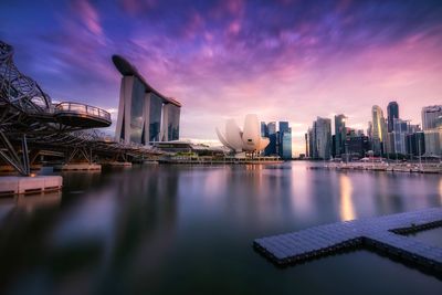 View of city buildings against cloudy sky