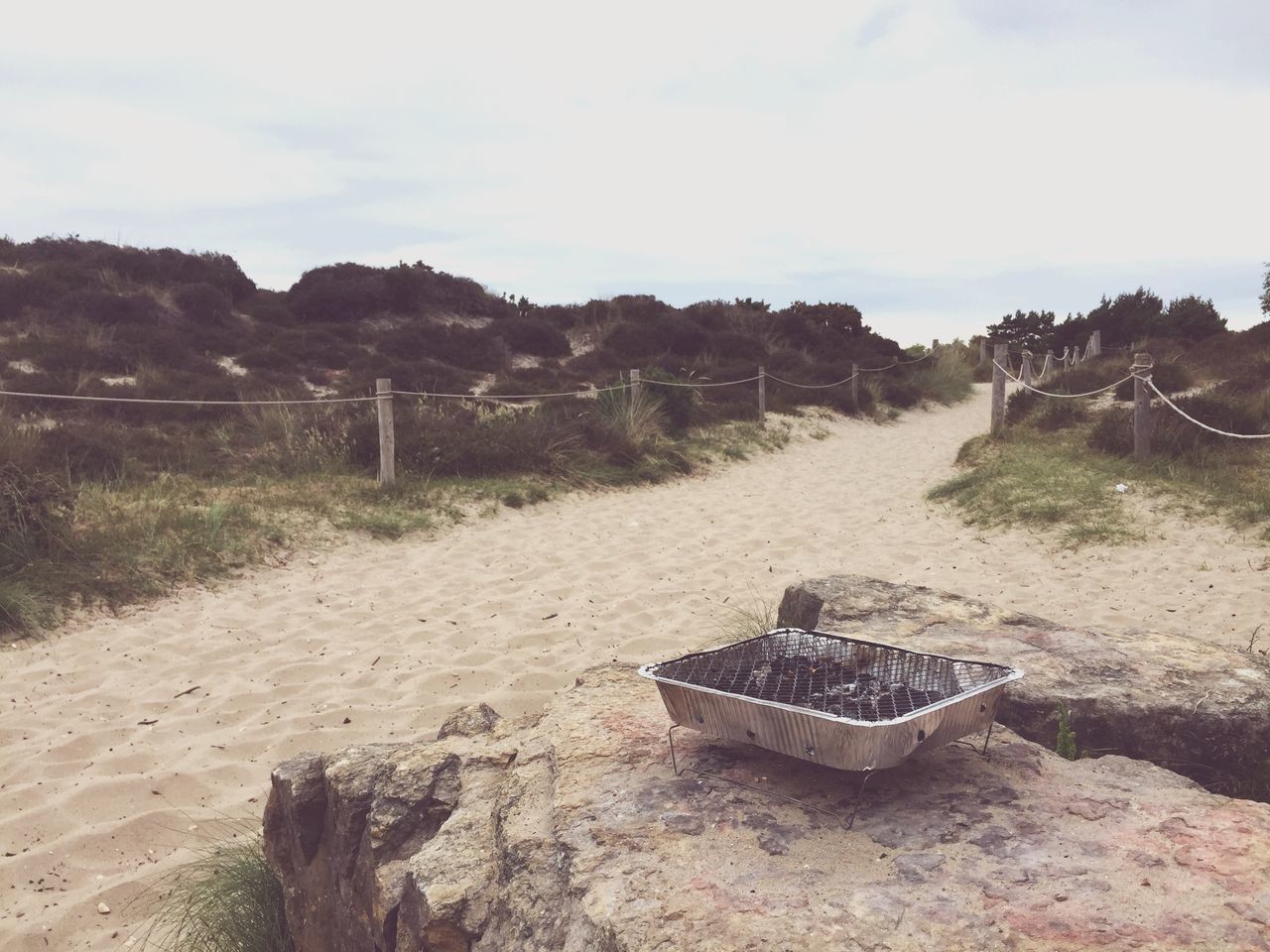 sky, sand, beach, tranquility, tranquil scene, abandoned, nature, tree, scenics, shore, obsolete, wood - material, damaged, absence, landscape, non-urban scene, outdoors, beauty in nature, no people, day