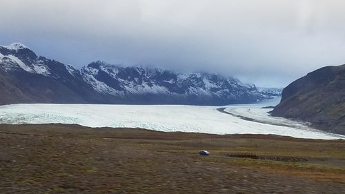 Scenic view of mountains against sky during winter