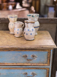 Close-up of old ceramics on table