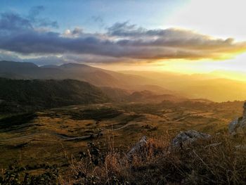 Scenic view of landscape against sky during sunset