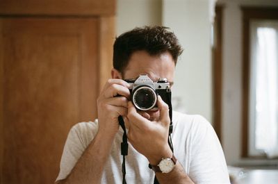 Portrait of man photographing
