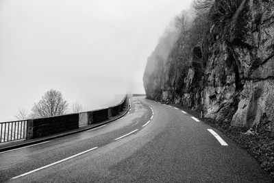 Curvy mountain pass road in foggy weather in the vosges, france
