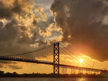 Low angle view of bridge against sky during sunset