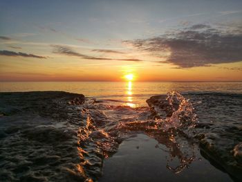 Scenic view of sea against sky during sunset