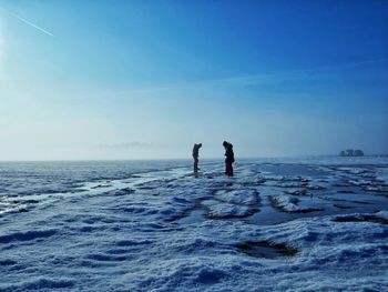 Scenic view of sea against sky during winter