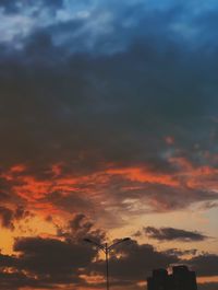 Low angle view of dramatic sky during sunset