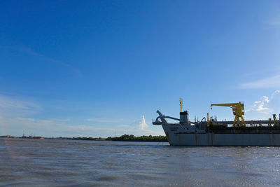 Scenic view of sea against blue sky