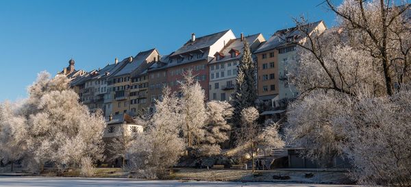 Buildings against clear sky in city