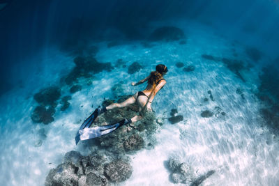 High angle view of woman swimming in pool