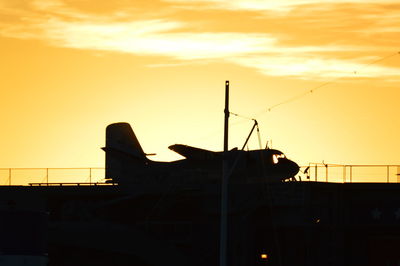 Silhouette of ship at sunset