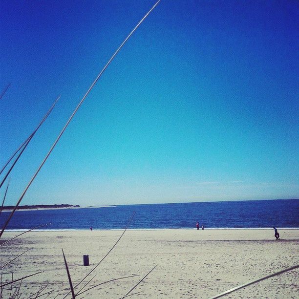 blue, water, sea, clear sky, copy space, horizon over water, tranquility, tranquil scene, scenics, nature, beauty in nature, nautical vessel, day, outdoors, sky, sailboat, transportation, sunlight, idyllic, beach