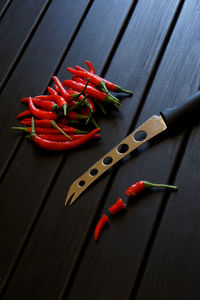 High angle view of red chili peppers on table
