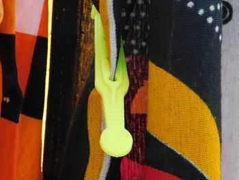 Close-up of multi colored paper hanging