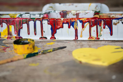 Close-up of multi colored pencils on street