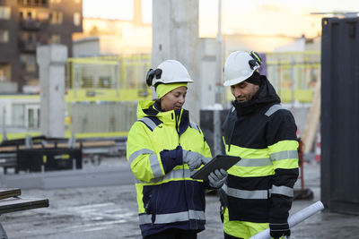 Construction engineers working at construction site