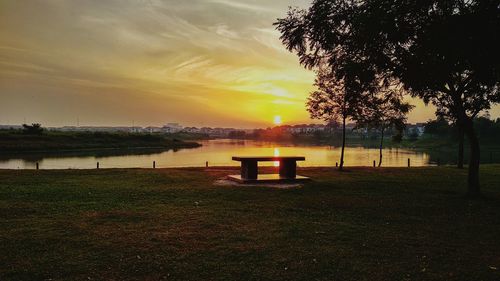 Scenic view of lake against sky during sunset
