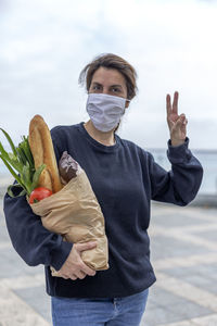 Portrait of woman carrying food