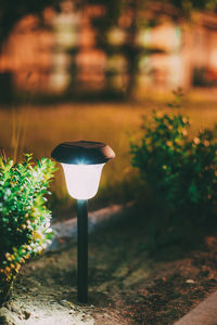 Close-up of illuminated lamp against blurred background