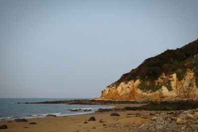 Scenic view of beach against clear sky