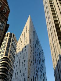 Low angle view of buildings against clear sky