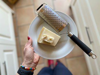 High angle view of woman holding ice cream