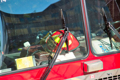 Reflection of man on car window