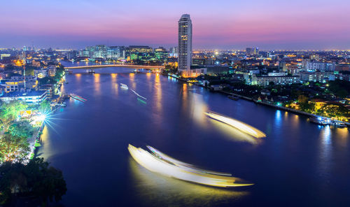 Aerial view of illuminated city at night