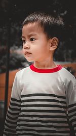 Portrait of cute boy standing outdoors