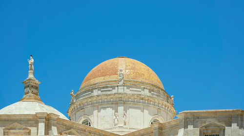 Low angle view of cathedral against clear blue sky