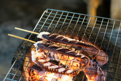 Close-up of meat on barbecue grill