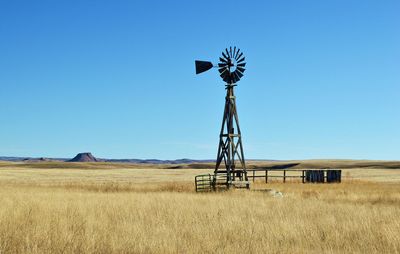 Windmill stands alone out in the open spaces