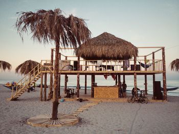 Restaurant at beach against sky