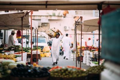 People working at market stall