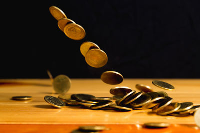 Close-up of coins on table