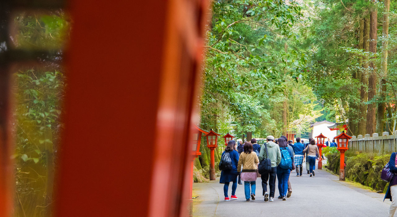 PEOPLE WALKING ON STREET IN CITY