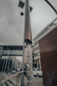 Low angle view of pipe on roof of building