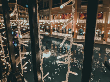 Illuminated lanterns hanging in city at night