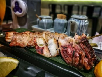 Close-up of meat on barbecue grill