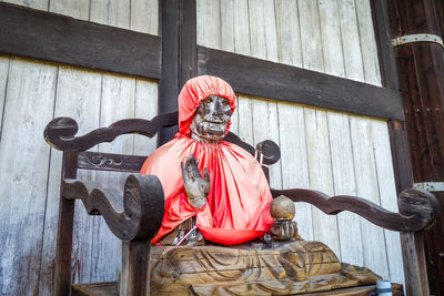 Statue against wall