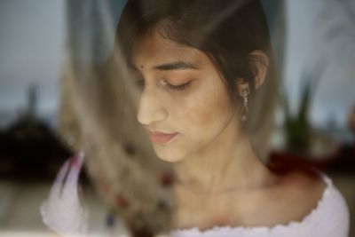 Woman seen through glass