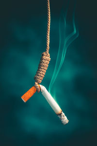 Close-up of ropes hanging on rope against blurred background