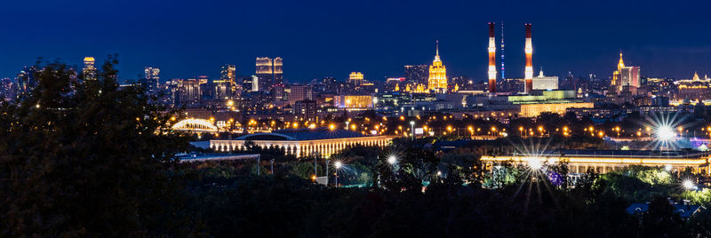 Illuminated buildings in city at night