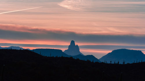 Scenic view of mountains against sky at sunset